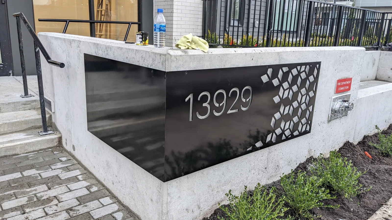 Custom metal monument address sign with laser-cut pattern, Metro Vancouver