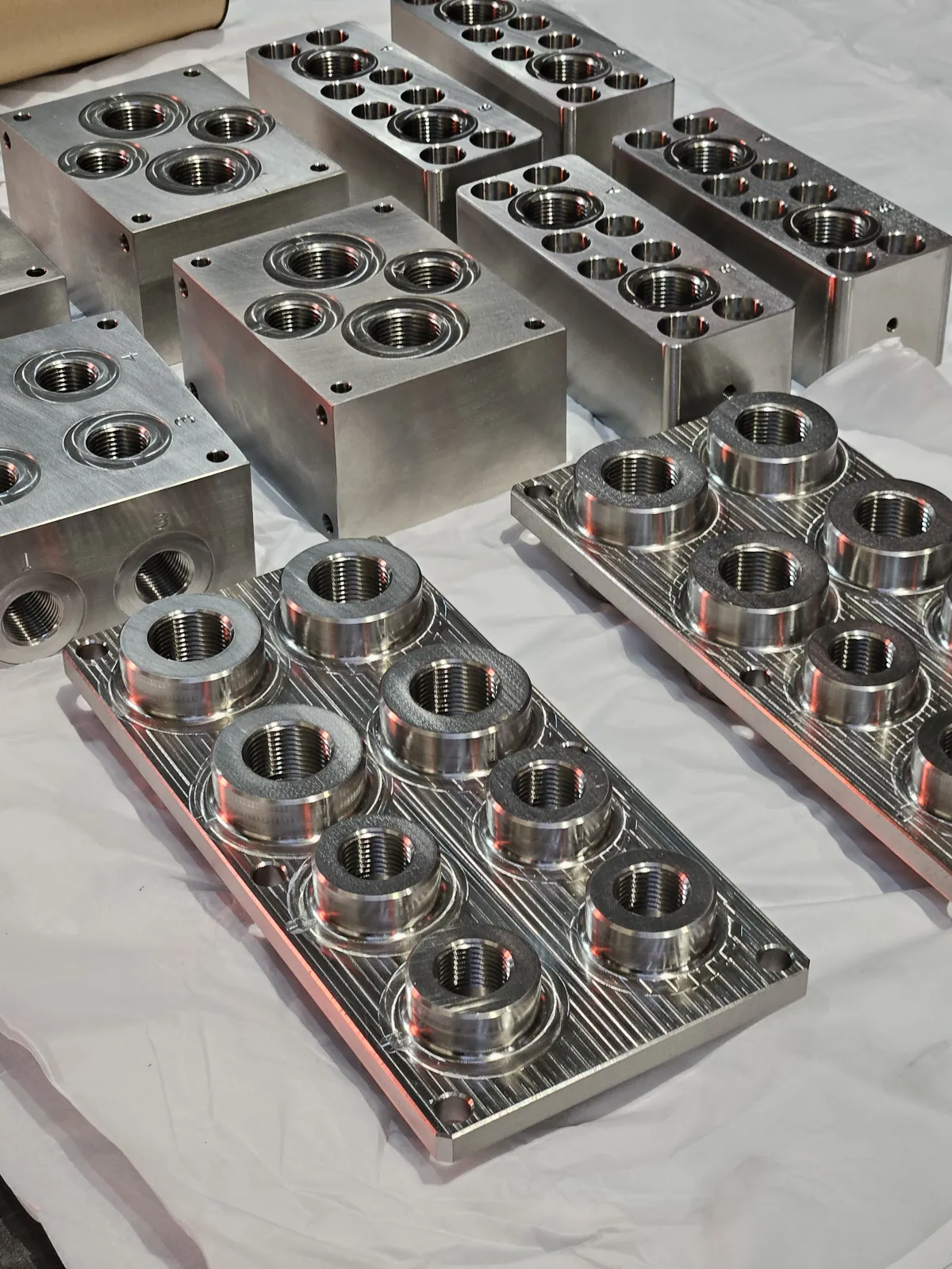 CNC machined aluminum manifold blocks with bored ports