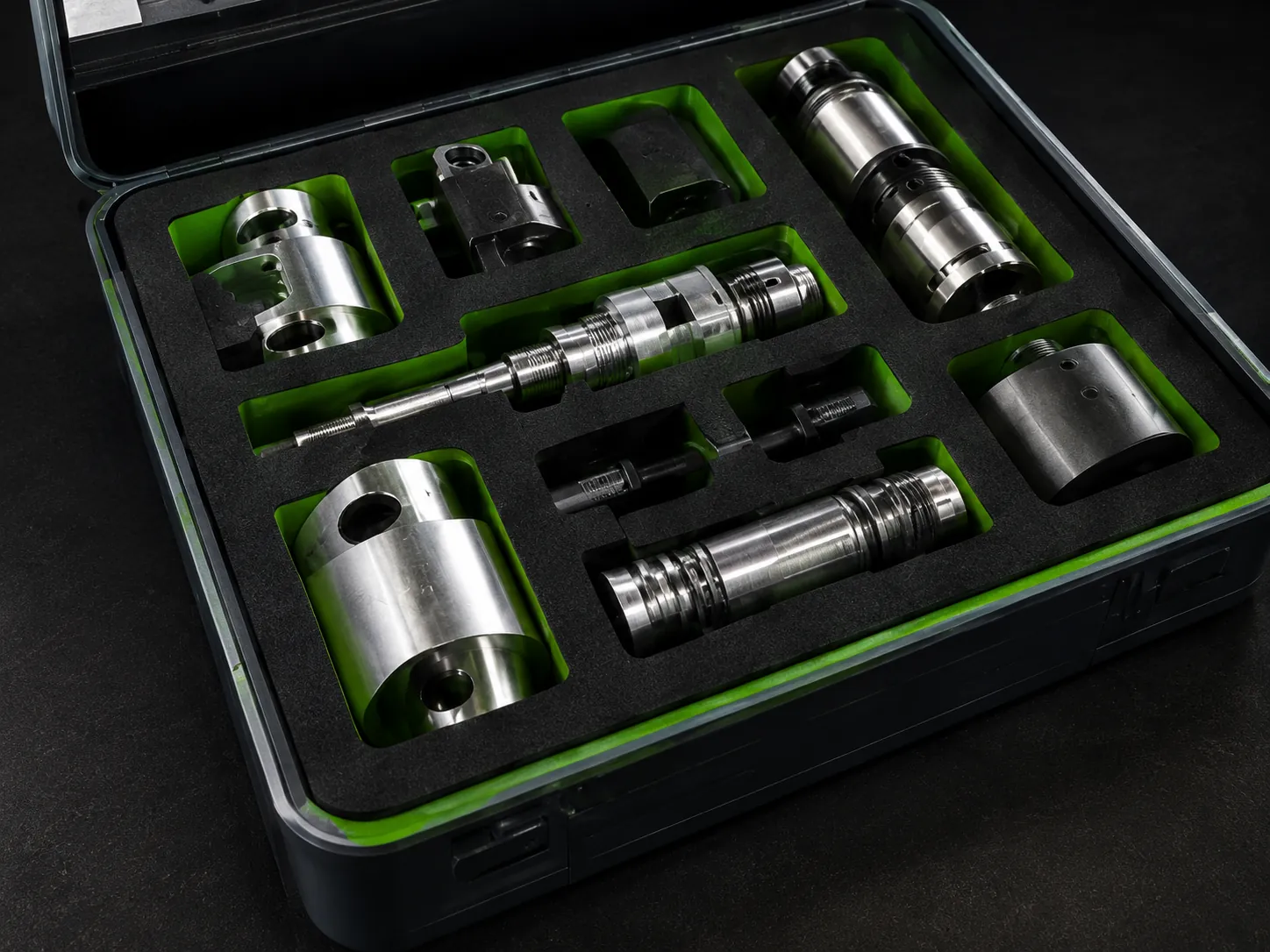 Two-tone black and green EVA foam insert in a hard case