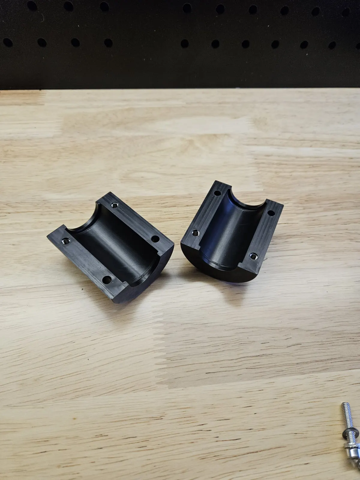 Black anodized split clamp, machining work by Spark Fabrication in Richmond, BC
